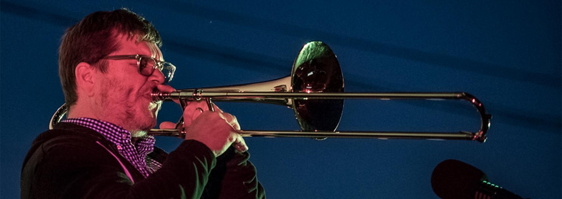 Jeff Albert plays trombone.